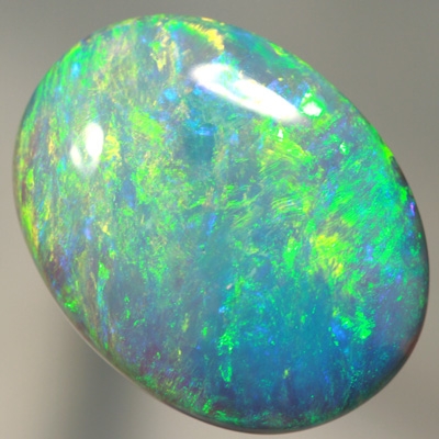 SOLID CRYSTAL OPAL Large opal. 11ct.  Bright green over purple. SEE VIDEO